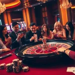 The excitement of gambling at UU88 with players around a roulette table in a luxurious casino environment.
